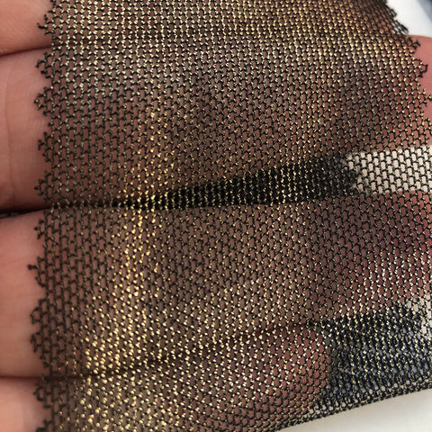 Gold on black metallic mesh