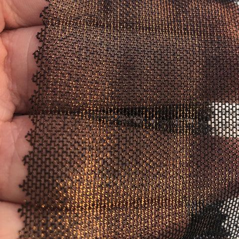 Copper on black metallic mesh